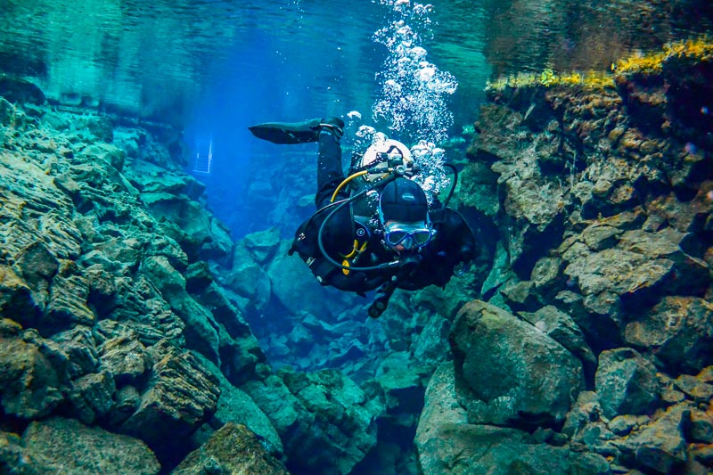 Cenotes in the riviera maya - diver inside - cenotes en la riviera maya