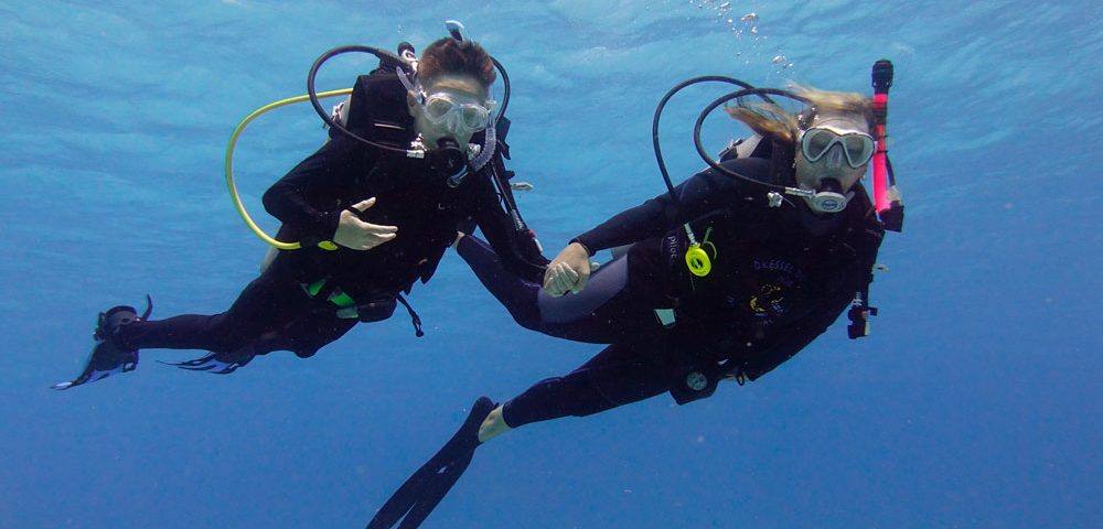 Family diving in the Caribbean - mother and child