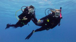 Family diving in the Caribbean - mother and child